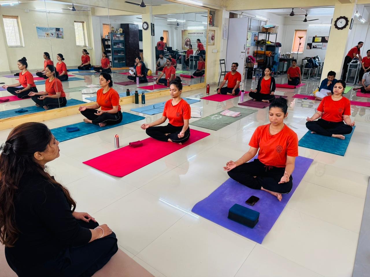 Sample group yoga class image; replace with an instructor photo